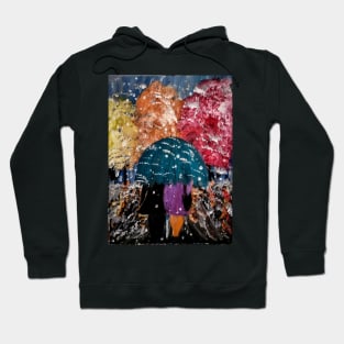 Couple walking through a snow Strom. Hoodie